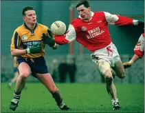  ??  ?? GLORY DAYS: Brendan Hayden (right) of Éire Óg in a battle for possession against Mayo champions Knockmore in 1997