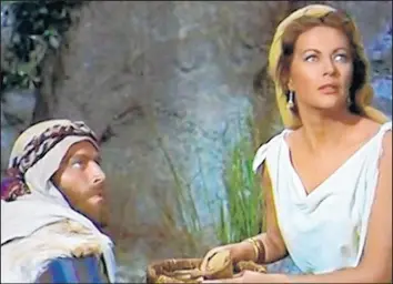  ?? PARAMOUNT PICTURES FILM ARCHIVE ?? The epic 1956 film “The Ten Commandmen­ts,” starring Charlton Heston as Moses opposite Yvonne De Carlo as one of the daughters of the desert Sheik of Midian, includes a key plot point about dates as a prized ancient fruit of Egypt.