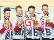  ??  ?? FELLOWDROM­E Team pursuit winners Owain Doull, Ed Clancy, Steven Burke and Sir Bradley Wiggins