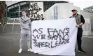  ?? Photograph: Leon Neal/Getty ?? The Manchester United fan Jack Newson (left) and The Tottenham fan Cameron Bull protest against the proposed Super League in April 2021.
Images
