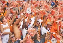  ?? STAFF PHOTO BY ERIN O. SMITH ?? Fans in the Tennessee student section cheer during the Vols’ 59-3 win against ETSU on Sept. 8 at Neyland Stadium. The Vols open their SEC schedule there tonight against Florida.