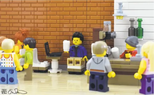  ?? Photos by Lego Grad Student ?? Patronizin­g a downtown hipster coffee shop that he realizes has no wi-fi or outlets, the grad student angrily — but gingerly — sips his $5 drink.