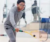  ??  ?? DeZyre Burns, 9, works on his backhand at MetroSquas­h, an after- school program in Woodlawn.
| SUPPLIED PHOTO