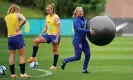  ?? Goodwin/PA ?? England’s manager, Sarina Wiegman, carries off the large ball that has been helping the squad to prepare. Photograph: Zac