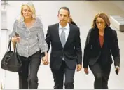  ?? Al Seib Los Angeles Times ?? MITCHELL ENGLANDER leaves court in Los Angeles in March 2020 with his wife and attorney.
