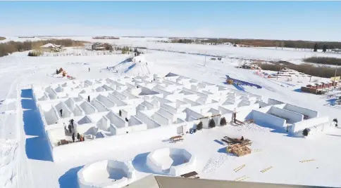  ?? — AFP photo ?? People play in a maze built by farmers Clint and Angie Masse in St Adolphe, Canada.