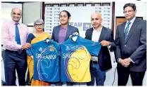  ??  ?? Handing over of the team jersey to Women’s T20 Captain Chamari Atapattu by Nimesh Amalean, General Manger - Marketing, MAS Active and Shaila Amalean Patron - Women Go Beyond programme, MAS Holdings.