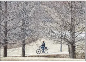  ?? (NWA Democrat-Gazette file/J.T. Wampler) ?? A rider pedals along the Razorback Greenway last February. Limits of cold-weather biking vary from rider to rider.