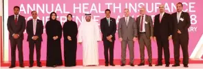  ??  ?? Dr Salem Al Darmaki and Dr Thumbay Moideen with speakers and awardees at the Annual Health Insurance Conference &amp; Award Ceremony 2018.