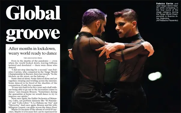  ?? ?? Federico Carrizo and Juan Segui dance Sept. 25 while competing in the final round of the stage category during the Tango World Championsh­ip in Buenos Aires, Argentina. (AP/Natacha Pisarenko)