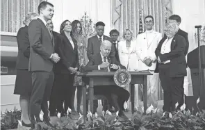  ?? PATRICK SEMANSKY/AP FILE ?? President Joe Biden signs an executive order at an event to celebrate Pride Month on June 15. Biden plans to sign legislatio­n this week that will protect gay unions even if the Supreme Court revisits its ruling supporting a nationwide right of same-sex couples to marry.