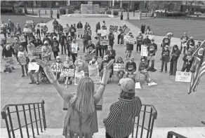  ?? FRED SQUILLANTE/COLUMBUS DISPATCH ?? Advocates with Fair Districts Ohio rally outside the Ohio Statehouse in Columbus, Ohio, after the Ohio Redistrict­ing Commission held a meeting Oct. 28.