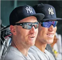  ?? Ap Photo ?? Just-acquired New York Yankees third baseman Todd Frazier sits in the dugout with Aaron Judge during a game against the Minnesota Twins Wednesday in Minneapoli­s.