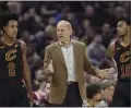  ?? TONY DEJAK — THE ASSOCIATED PRESS ?? John Beilein, center, talks with Collin Sexton, left, and Darius Garland on Feb. 12during a game against the Hawks.