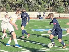  ?? NICK MALLARD / SENTINEL & ENTERPRISE FILE ?? North Middlesex Regional's Jake Richard controls the ball as Littleton's Kevin Burreta defends during an Oct. 8 game.