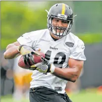  ?? AP PHOTO ?? Christian Scotland-williamson of London, a young rugby star back in England, hopes to land a job with the NFL’S Pittsburgh Steelers.