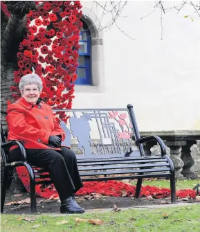  ??  ?? Special tribute Aileen Hawthorn with poppy display at Livingston Village Parish Church.