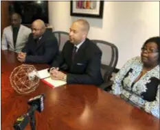  ?? JEFF AMY — THE ASSOCIATED PRESS ?? Attorney Carlos Moore, second from right, speaks Wednesday in Ridgeland, Miss., about a lawsuit filed concerning the 11-year detention of Steven Jessie Harris in the Clay County jail in West Point, Miss. From left: Pastor Stephen Dennis, Harris’ twin brother Steven Jeffrey Harris, Moore and Harris’ guardian and sister-in-law, Rachel Harris, attended the news conference.