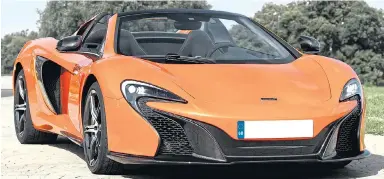  ??  ?? Vitus the donkey couldn’t resist the carrot-coloured paintwork of a McLaren 650S Spider, above