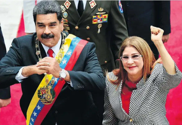  ?? FEDERICO PARRA / AFP / GETTY IMAGES ?? Venezuelan President Nicolas Maduro and his wife Cilia Flores, who has been described as her husband’s “strong arm.”