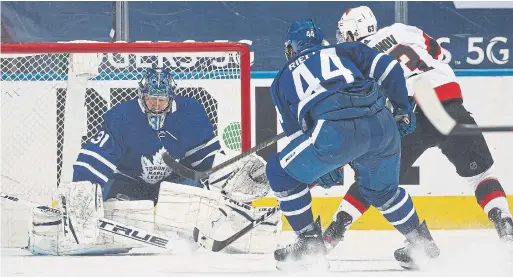  ?? CLAUS ANDERSEN GETTY IMAGES ?? After the Senators erased a four-goal deficit to force overtime, Evgenii Dadonov beat Leafs defenceman Morgan Rielly and goalie Frederik Andersen to end it.