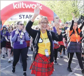  ?? ?? A walker sets off from Glasgow Green for this year’s Kiltwalk, which has raised a record sum for charity