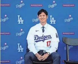  ?? ASHLEY LANDIS/AP ?? The Dodgers’ Shohei Ohtani answers questions during a news conference at Dodger Stadium on Dec. 14 in Los Angeles.