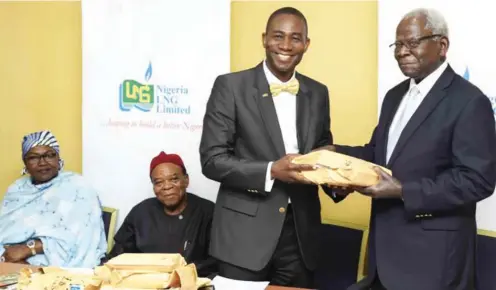  ??  ?? NLNG Manager of External Relations, Dr. Kudo Eresia-Eke handing over the entries for the 2017 prize to Prof Ayo Banjo, chair of the prize governing board at an event in Lagos