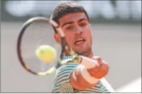  ?? (AFP) ?? Spain’s Carlos Alcaraz Garfia plays a forehand return to Japan’s Taro Daniel during their men’s singles match on day four of the French Open at the Court Philippe-Chatrier in Paris on Wednesday.