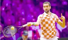  ??  ?? Croatian player Marin Cilic returns a ball to French Lucas Pouille during their singles rubber for the Davis Cup final tennis match between France and Croatia at The Pierre Mauroy Stadium in Villeneuve-d’Ascq. — AFP photo