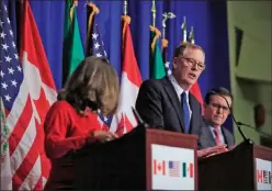  ?? The Associated Press ?? U.S. Trade Representa­tive Robert Lighthizer, centre, with Canadian Minister of Foreign Affairs Chrystia Freeland, left, and Mexico’s Secretary of Economy Ildefonso Guajardo Villarreal, speaks in Washington last October.