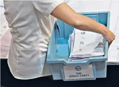  ??  ?? Clear message? Brexit Party ballot papers at the count in Kettering, Northampto­nshire