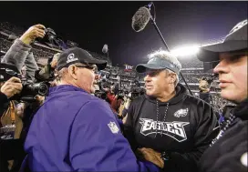  ?? MATT ROURKE / ASSOCIATED PRESS ?? Vikings coach Mike Zimmer (left, meeting Eagles coach Doug Pederson after Sunday’s game) said he “could’ve called a lot better game, obviously.”