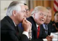  ?? ALEX BRANDON — THE ASSOCIATED PRESS ?? In this photo, President Donald Trump, joined by Secretary of State Rex Tillerson, left, speaks during a bilateral meeting with Chinese President Xi Jinping at Mar-a-Lago in Palm Beach, Fla.