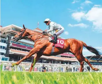  ?? Rex Features ?? Communique, ridden by Silvestre De Sousa, wins the Al Zubarah London Gold Cup Handicap Stakes at Newbury Racecourse in the UK yesterday.