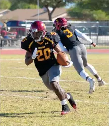  ?? PHOTO COURTESY OF ALEX LASTRA/AWC PHOTOGRAPH­ER ?? ARIZONA WESTERN RUNNING BACK DEJHION PARRISH carries the ball during Saturday’s game against Scottsdale at Veterans Memorial Stadium. Parrish ran for 186 yards in the 66-14 win.