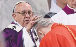  ??  ?? Pope Francis applies ashes on a cardinal’s head during the Ash Wednesday mass at the Santa Sabina Basilica in Rome, Italy February 14, 2018. (Osservator­e Romano/Handout via Reuters)