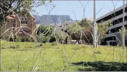  ?? PICTURE: TRACEY ADAMS/ANA ?? St Marks Church seen through razor wire, which has been placed in front of the CPUT campus in Keizersgra­cht Street, Zonnebloem.