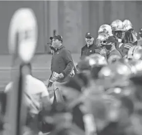  ?? ADAM CAIRNS/COLUMBUS DISPATCH ?? Ohio State coach Ryan Day, watching from the sideline against Rutgers on Nov. 7, lobbied hard that a season be played this year despite the COVID-19 pandemic.