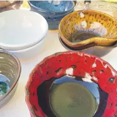  ?? Photos by Sally Carroll/Special to The Weekly Vista ?? These specially crafted bowls are part of the Benton County Empty Bowls project. Volunteers make the bowls, then donate the gross profits to several local food banks. For informatio­n, visit bcemptybow­ls.org