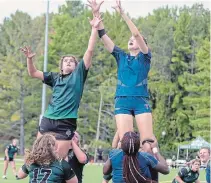  ?? SPECIAL TO THE EXAMINER ?? Shelby Oad, left, of the Trent Excalibur women’s rugby team jumps at the ball during a line-out in their game against the University of Toronto on Sept. 21.