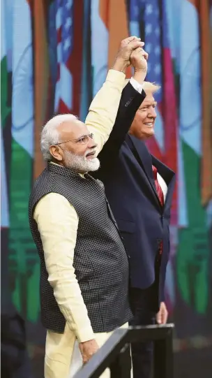  ?? Steve Gonzales / Staff photograph­er ?? Indian Prime Minister Narendra Modi and President Donald Trump together greet the 50,000 in attendance for “Howdy, Modi!” on Sunday at NRG Stadium.