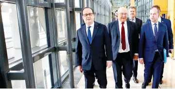  ??  ?? (From left) Hollande, Finance Minister Michel Sapin, dead of Anti-corruption Agency Charles Duchaine and Justice Minister Jean-Jacques Urvoas (right) arrive to inaugurate the French Anti-corruption Agency at Bercy Economy ministry in Paris. The French...