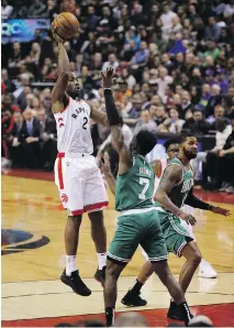  ?? JACK BOLAND ?? Kawhi Leonard puts up a shot against the Boston Celtics Friday night at Scotiabank Arena in Toronto. Leonard finished with 31 points as the Raptors improved to 2-0 with a 113-101 victory.