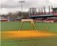  ?? ?? The new lighting rig gets to work on the pitch