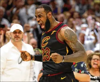  ?? GREGORY SHAMUS / GETTY IMAGES ?? LeBron James scored 46 points and added 11 rebounds and nine assists while playing all but two minutes — to avoid eliminatio­n with a 109-99 win over the Celtics on Friday in Cleveland.