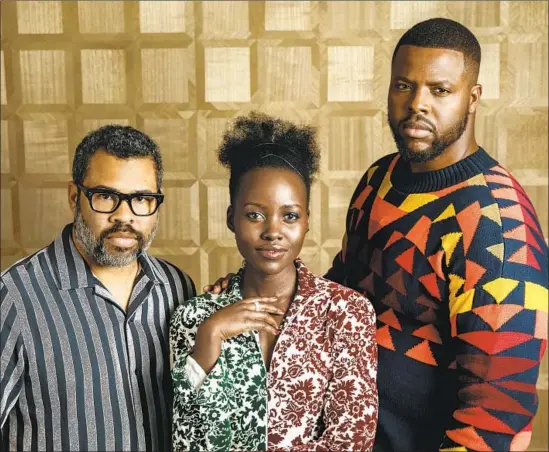  ?? Marcus Yam Los Angeles Times ?? JORDAN PEELE, left, wrote and directed “Us,” which costars Lupita Nyong’o and Winston Duke in two roles apiece, both playing good and evil doppelgäng­ers.