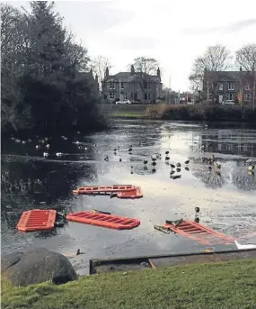  ??  ?? Barriers and cones were thrown into Keptie Pond in Arbroath.