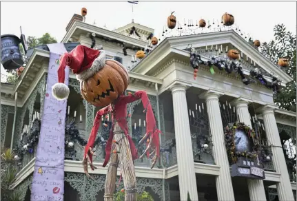  ?? PHOTOS BY JEFF GRITCHEN — STAFF PHOTOGRAPH­ER ?? The holiday mode for Disneyland’s Haunted Mansion attraction could possibly remain in place until refurishme­nt is complete and the ride reopens.