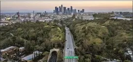  ?? Robert Gauthier Los Angeles Times ?? LESS TRAFFIC and cleaner air are among the advantages of a declining population, some say. Above, a nearly empty 110 Freeway on April 28, 2020.